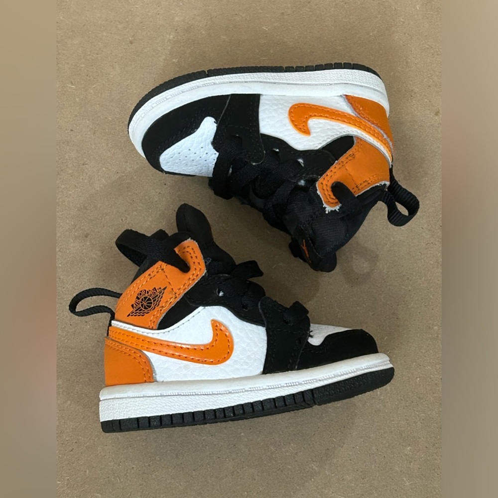 Jordan Baby Sneakers in Black, White, and Orange